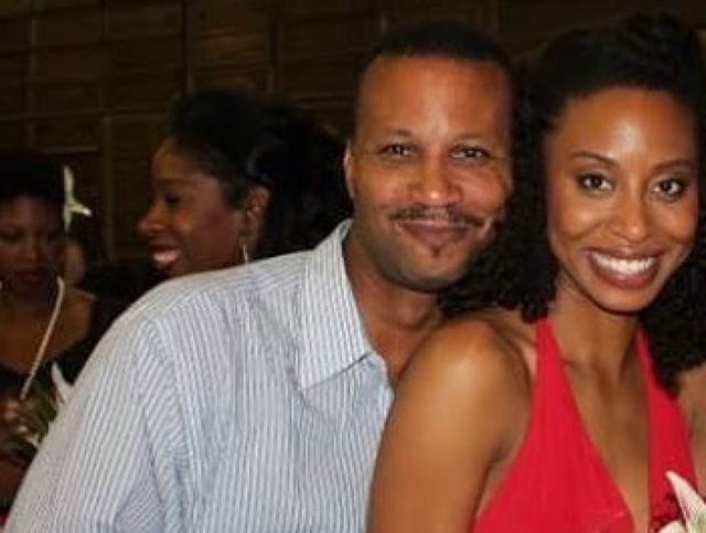 Yasha Jackson in a red dress with her father in a lined shirt.